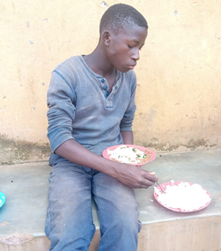 SA-street-kid-eating Street child eating food sent and prepared